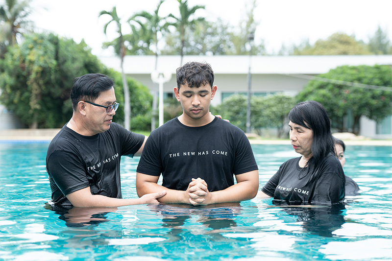 Church leader speaking from a stage.